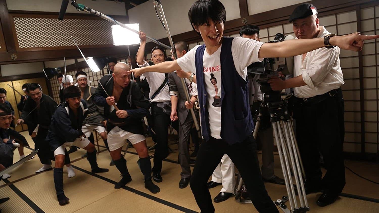 Backdrop of Why Don't You Play in Hell?