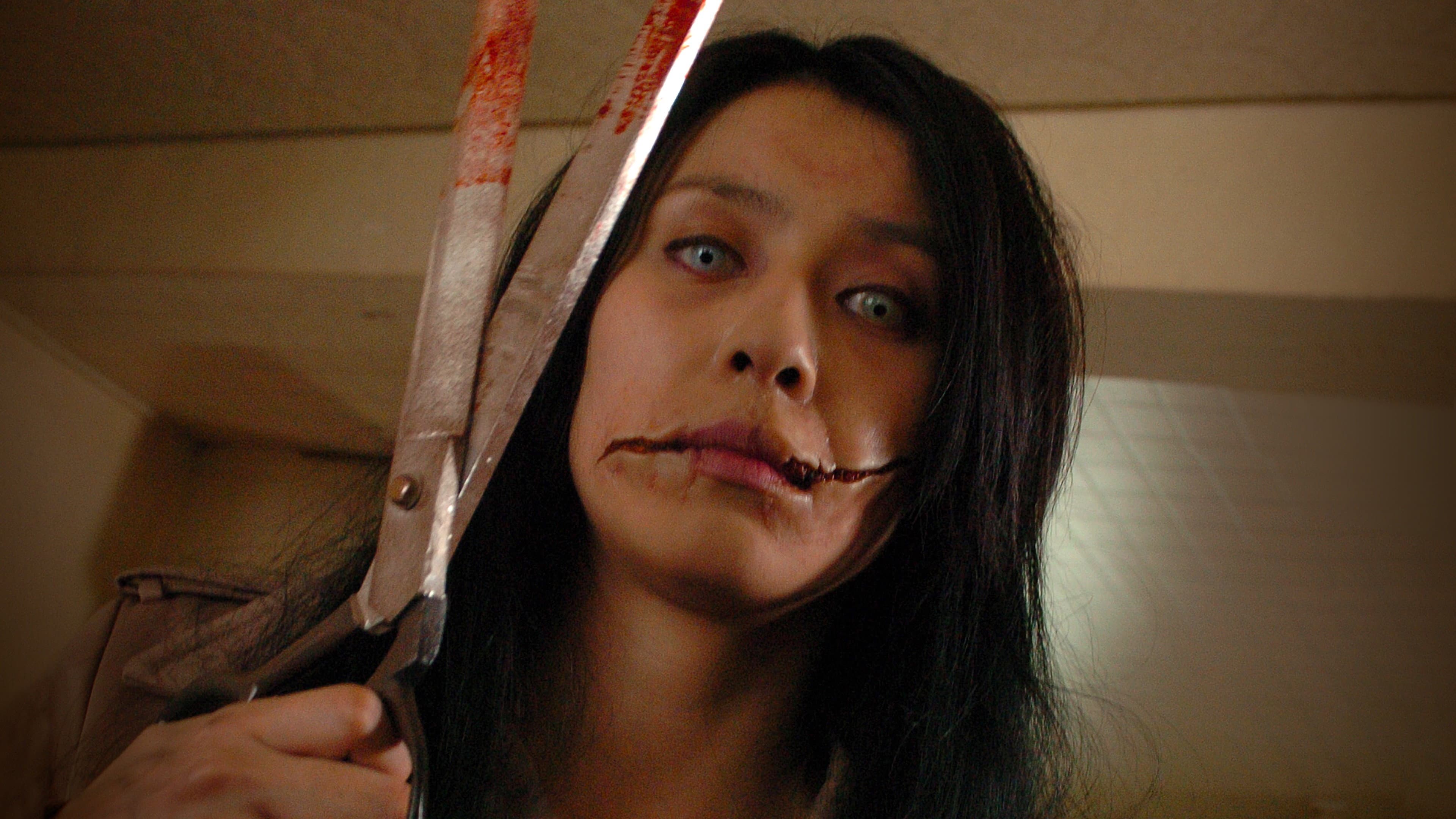 Backdrop of Carved: The Slit-Mouthed Woman