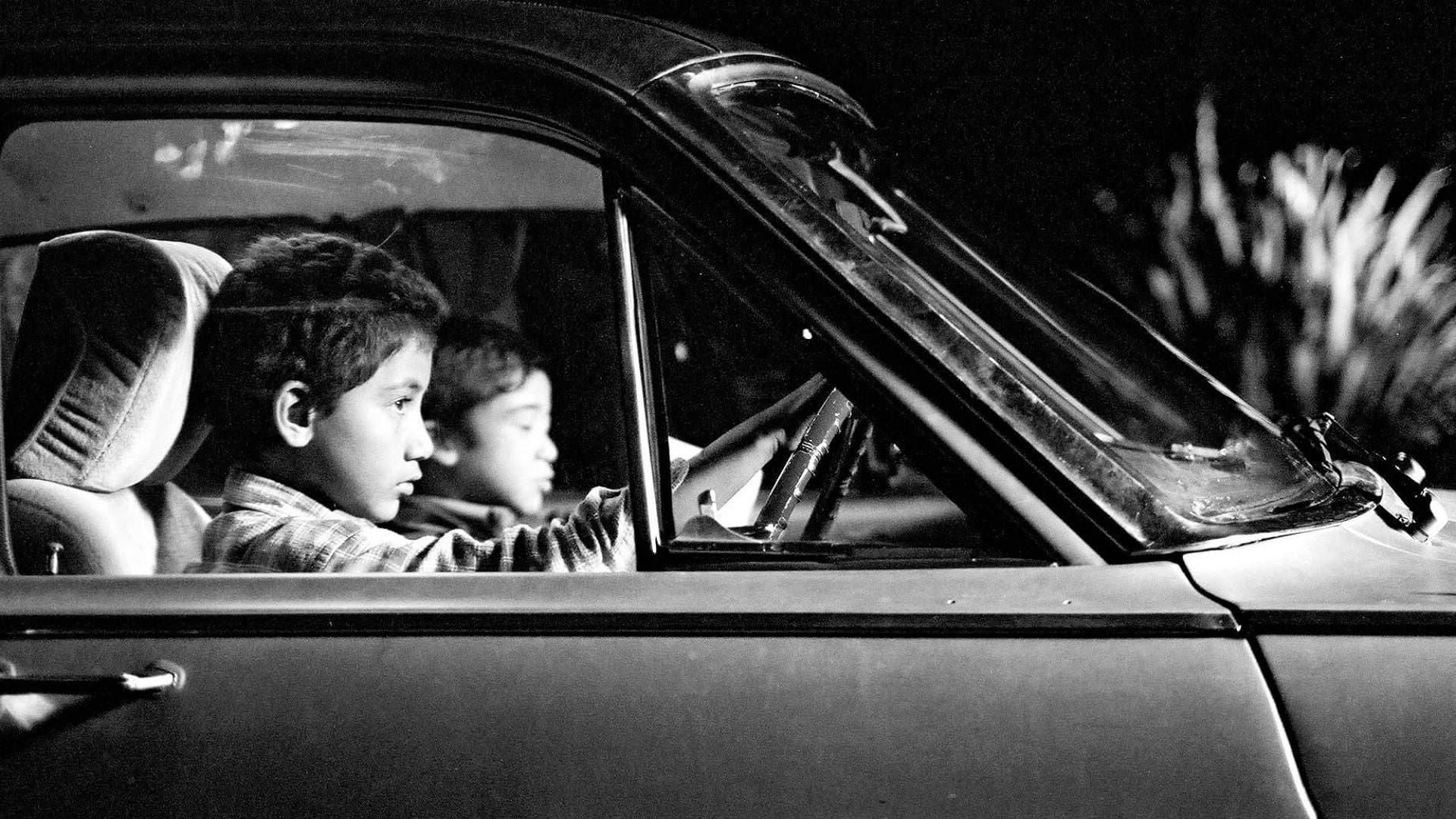 Backdrop of Two Cars, One Night