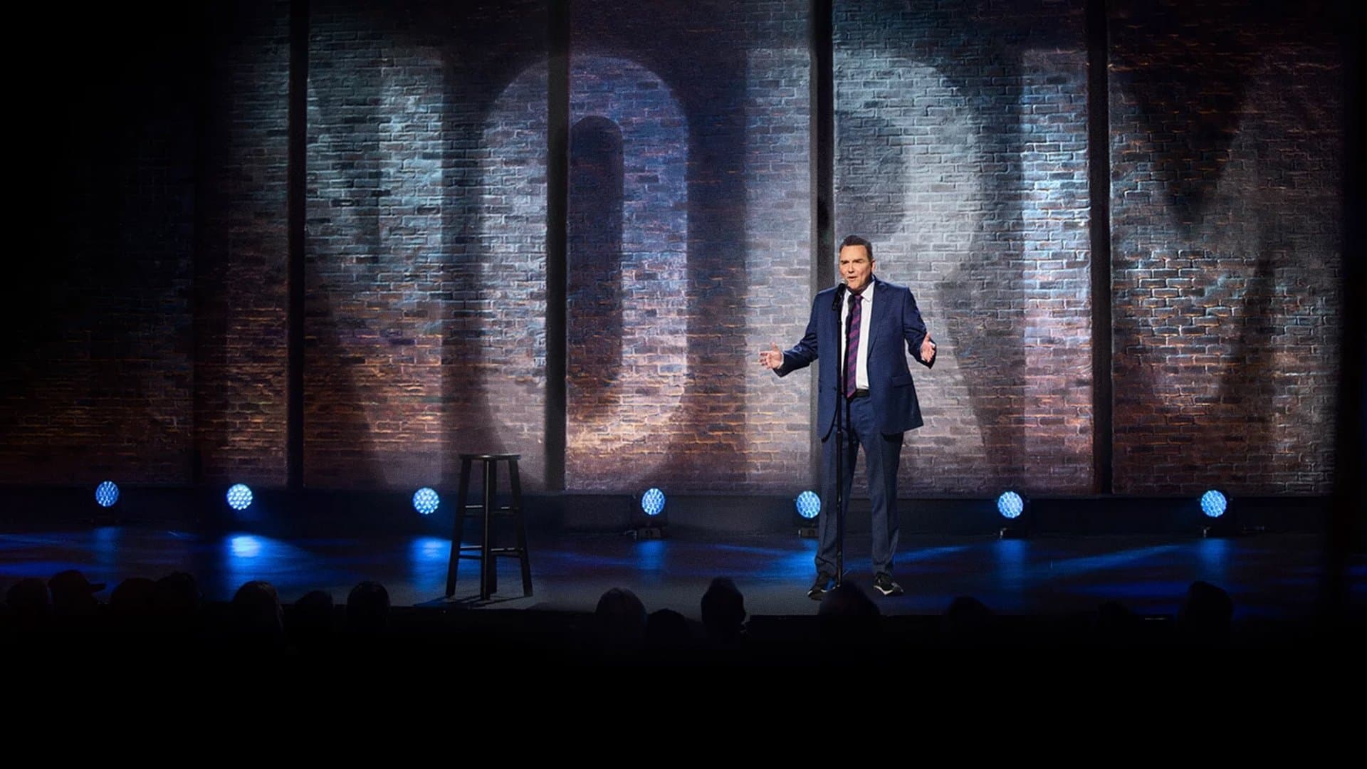 Backdrop of Norm Macdonald: Hitler's Dog, Gossip & Trickery